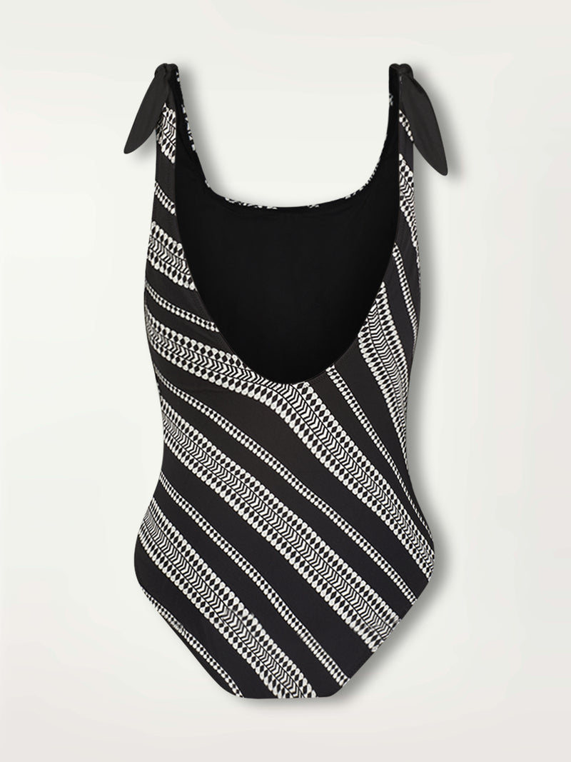 Product Shot of the back of the Luchia Nageur one piece swimsuit in black white white graphic diamond and arrows pattern.