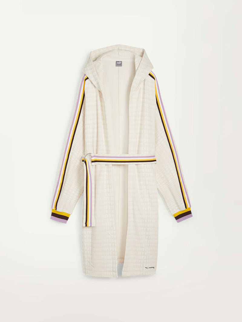 Product Front Shot of Puma x lemlem Anorak in Warm White Color, featuring lemlem triangle pattern and color stripe details in violet, dark chocolate, white and yellow colors 