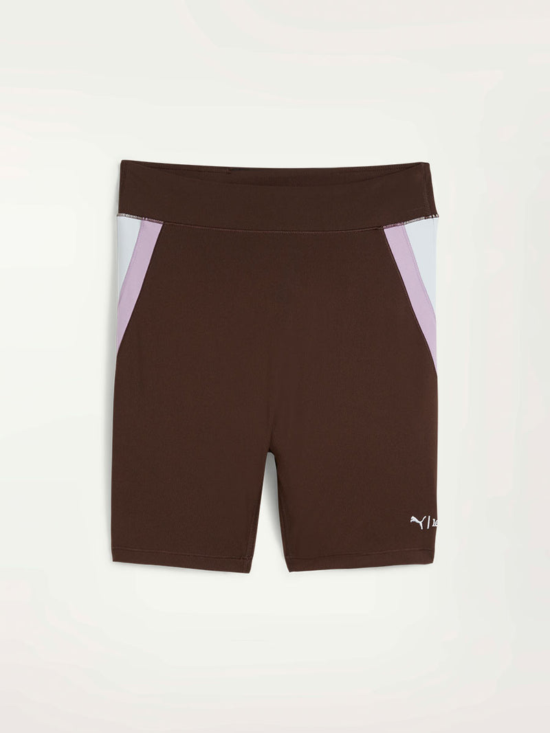 Product Front Shot of Puma x lemlem Biker Shorts Featuring Dark Chocolate Color and color block details on hips in Violet and White Colors