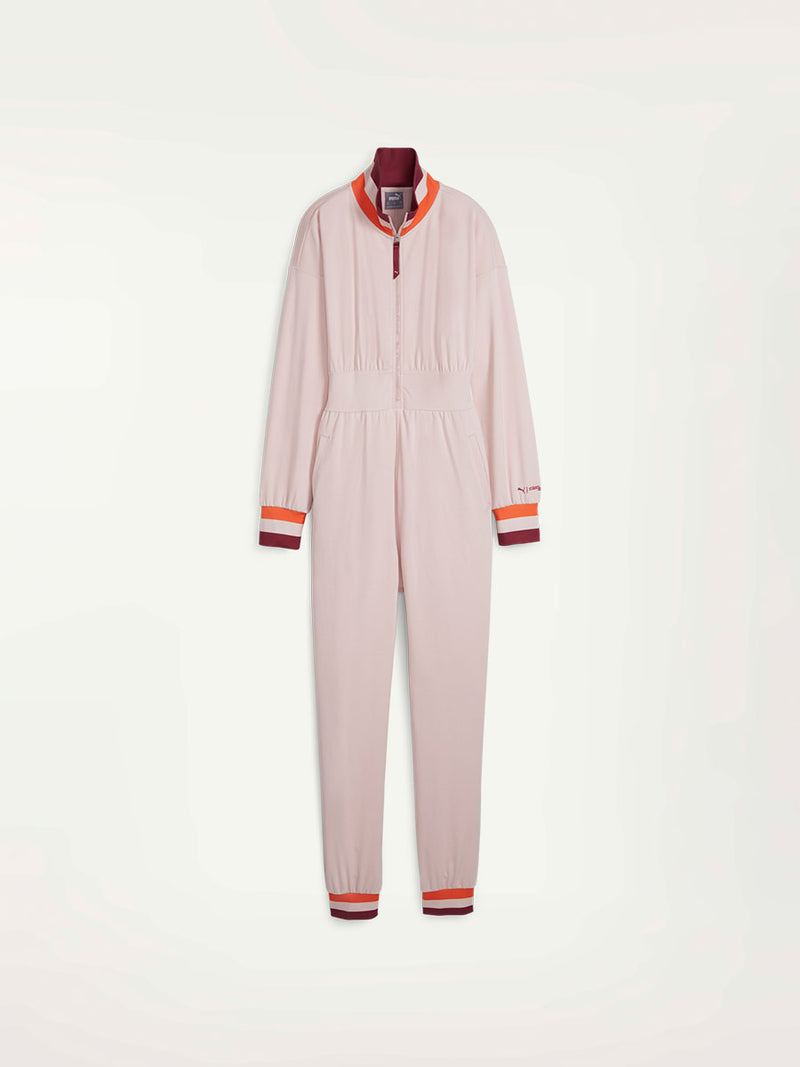 Product Front Shot of Puma x lemlem Jumpsuit featuring Rose Quartz Color, color block details in orange and red colors on collar, arf cuffs and ankle cuffs. 