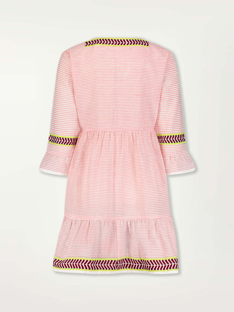 Product Back Image of Hanna Flutter Dress featuring delicate pink stripes with a bold chevron patterned ribbon, along with muted hues of pink, burgundy, and a bright citrus-orange hue.