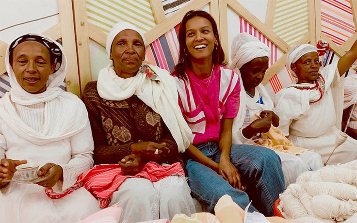 Founder Liya Kebede sitting with the women artisans in Ethiopia