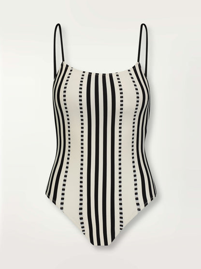 Product shot of the Eshe Classic One Piece featuring architectural and textured black stripes and dotted lines on an off white background.