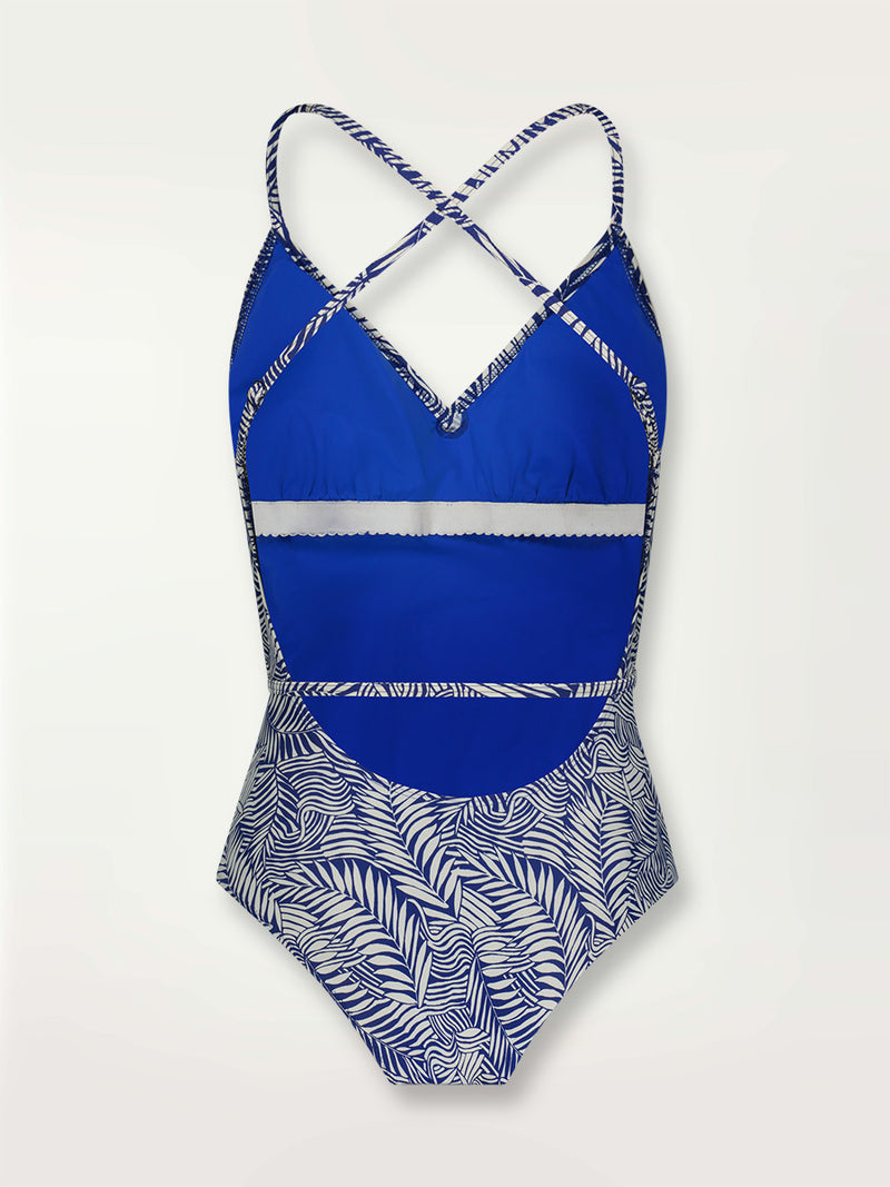 Product shot of the back the Palm Leaf Ballet One Piece featuring palm tree patterns on a rich blue background.