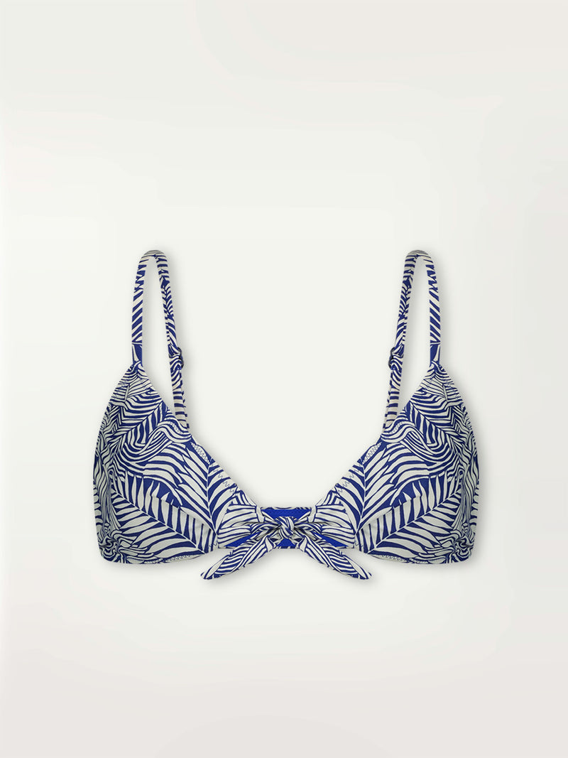 Product shot of the Palm Leaf Tie Front Bikini Top featuring palm tree patterns on a rich blue background.