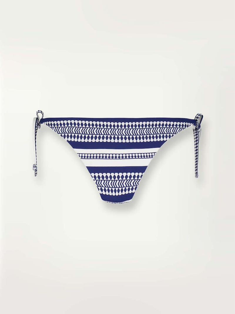 product shot the Luchia String bikini bottom in navy with graphic white diamond and arrows.