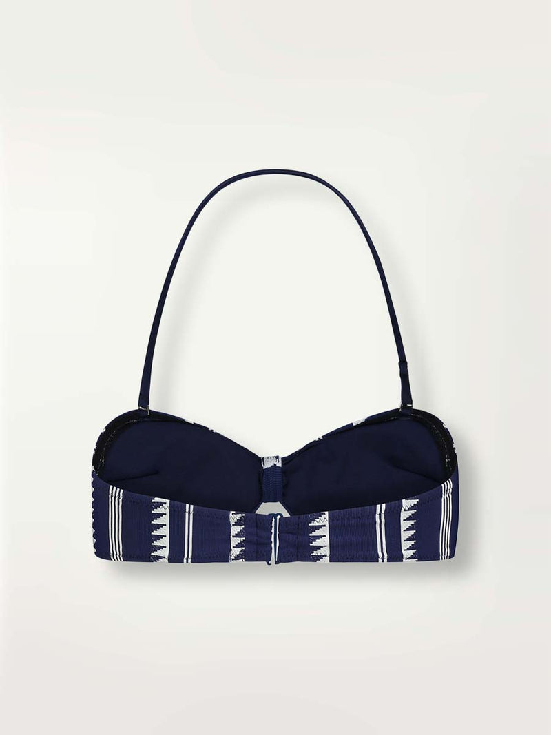 Product-shot back view of a navy Nunu bandeau swim top with white triangles and stripes