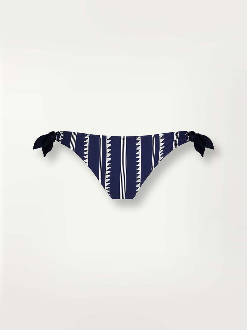 Product-shot navy Nunu side tie bikini bottom with white triangles and stripes