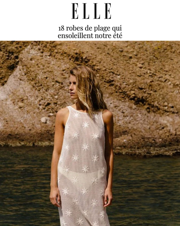 Cover of ELLE Article "Beach dresses" featuring woman in a white sheer dress
