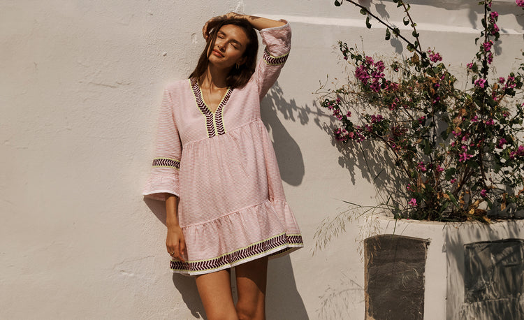 Woman Standing Wearing lemlem Kesiti Pink Flutter Dress featuring Pink color 