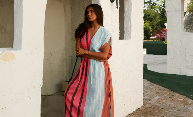 Woman Standing Wearing Leila Plunge Dress in Zula Layercake color