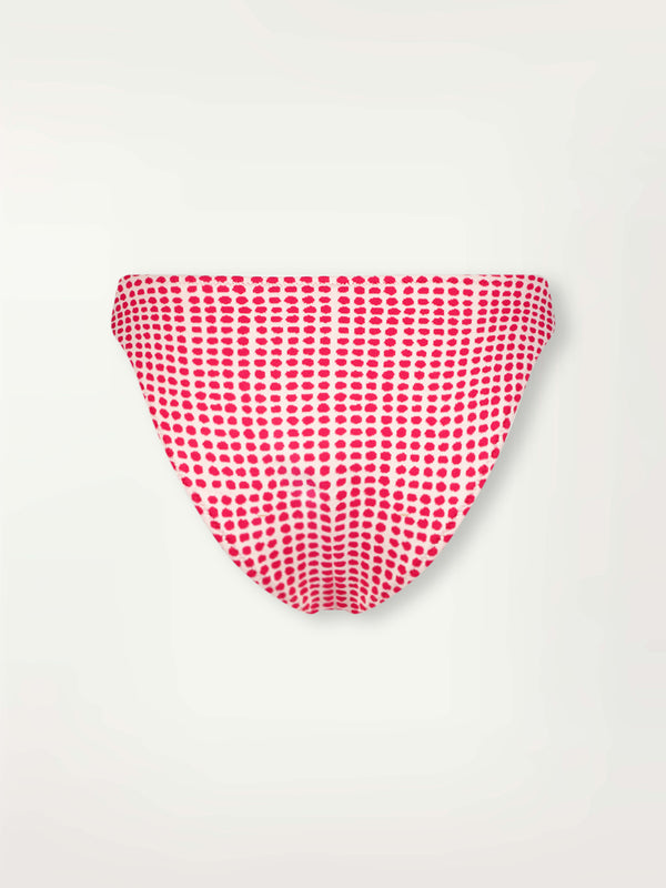 Product Back Shot of lemlem Meron Brief Bottom featuring vibrant raspberry dots on an ivory background