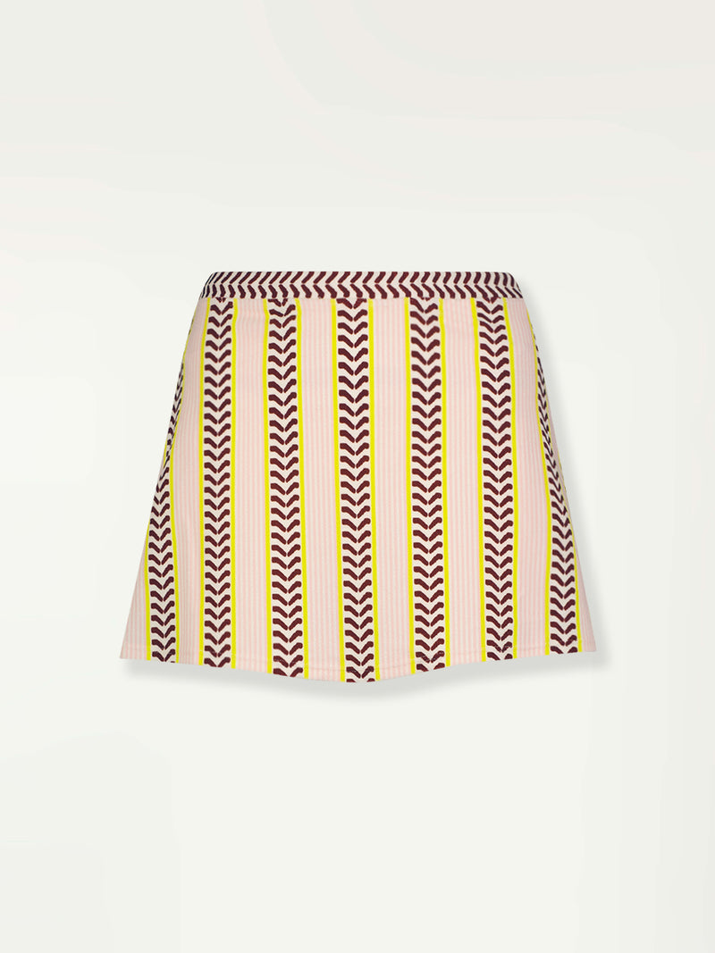 Product Front Shot of a Zera Skirt featuring delicate pink stripes with a bold chevron patterned ribbon, along with muted hues of pink, burgundy, and a bright citrus hue.
