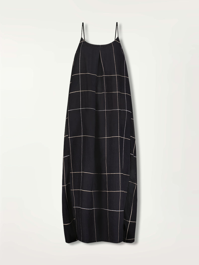 Product Front Shot of Nia Slip Dress featuring Big White Plaid Pattern on Black Cotton Background