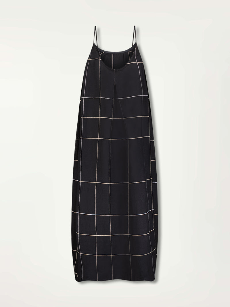 Product Back Shot of Nia Slip Dress featuring Big White Plaid Pattern on Black Cotton Background