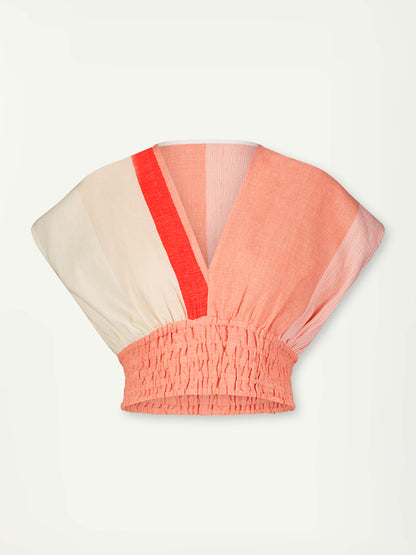 Product Front Shot of Alia Plunge Top Featuring asymmetric color block details in tan and blush colors highlighted with bright orange on the soft cream background.