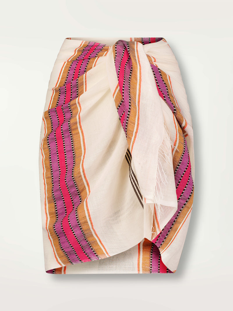 Product Front Shot of Lema Sarong featuring stripe pattern in magenta, ochre, and berry tones, delineated by black and white dots and accented with a splash of neon orange on natural cotton background