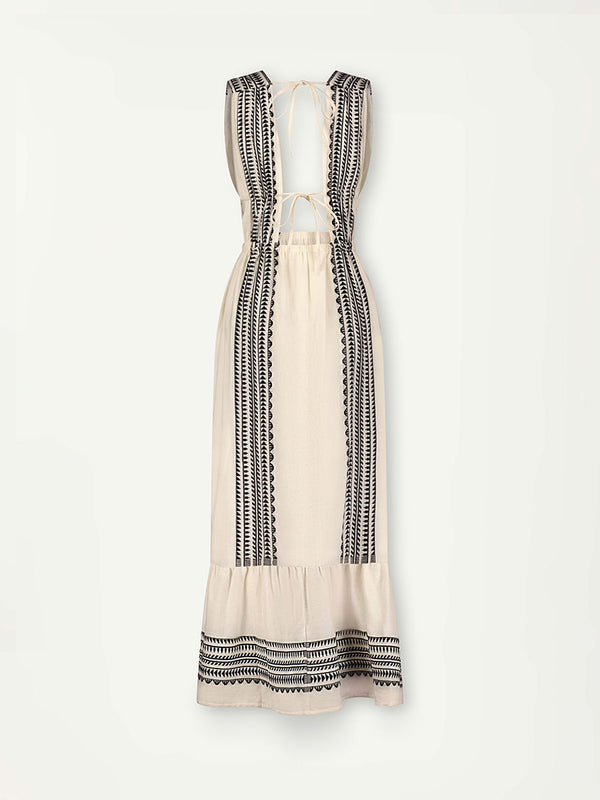 Product Back Shot of Lelisa V Neck Dress featuring intricate black Tibeb bands on a textured vanilla background.