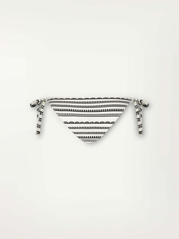 Product Back Shot of a Rekka String Bikini Bottom featuring intricate black Tibeb bands on a textured white background.