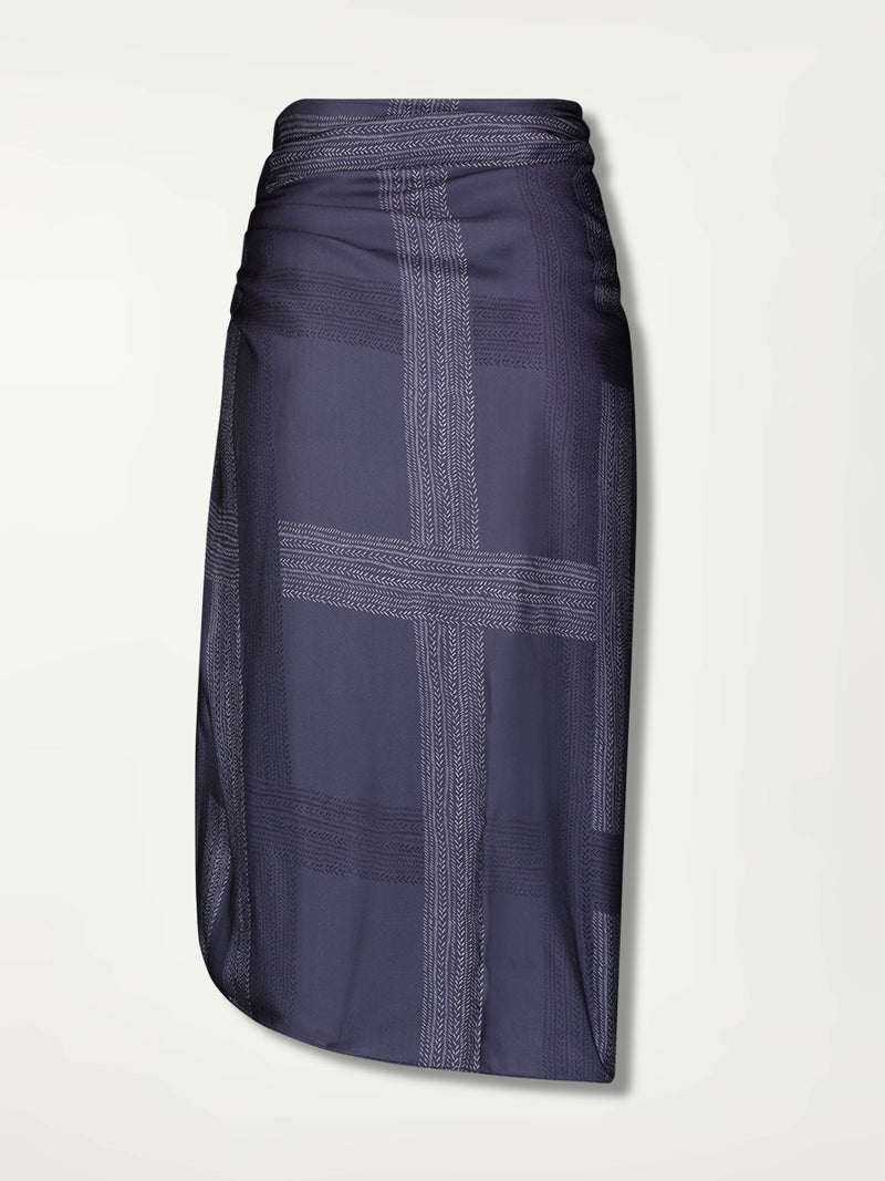 Product Back Shot of Adia Sarong featuring alternating neutral and charcoal stripes set against a cool steel blue background