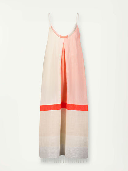Product Front Shot of Nia Slip Dress Featuring asymmetric color block details in tan and blush colors highlighted with bright orange on the soft cream background.