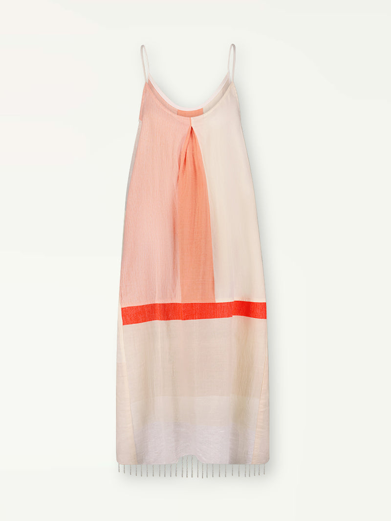 Product Back Shot of Nia Slip Dress Featuring asymmetric color block details in tan and blush colors highlighted with bright orange on the soft cream background.