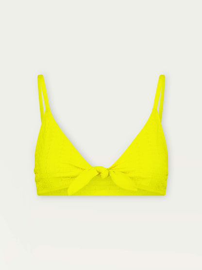 Product Front Shot of Sara Tie Front Top featuring a textured down sampled Jordanos pattern in a bright flattering citron color
