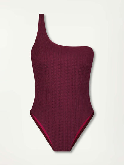 Product Front Shot of a Amelia One Shoulder One piece Featuring featuring a downsampled Jordanos Pattern in a luxurious burgundy hue