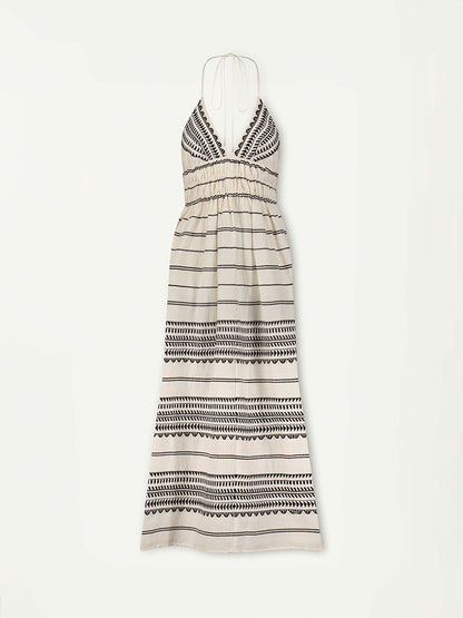 Product Front Shot of lemlem Gete Triangle Dress featuring intricate black Tibeb bands on a textured vanilla background.