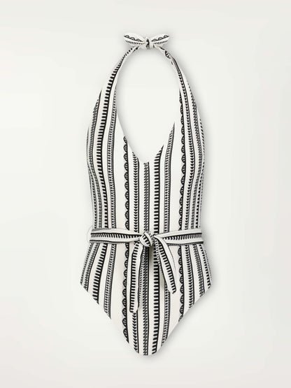 Product Front Shot of a Lidya Deep V One Piece featuring intricate black Tibeb bands on a textured white background.