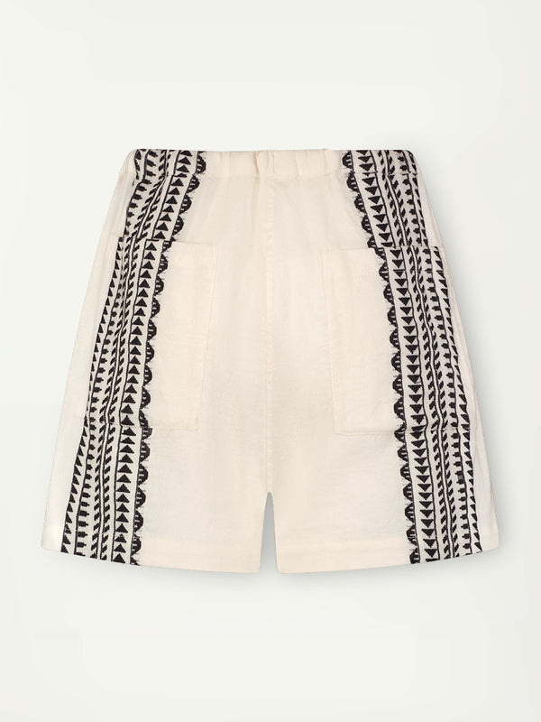 Product Back Shot of Safia Shorts  featuring intricate black Tibeb bands on a textured vanilla background.