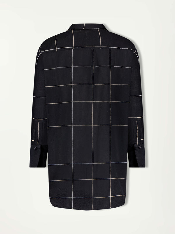 Product Back Shot of the Mariam Oversized Shirt featuring Big White Plaid Patten on Black Cotton Background