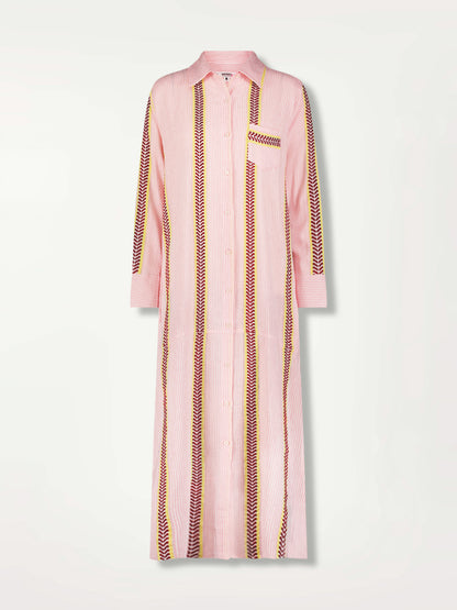 Product Front Image of Anata Shirt Dress featuring delicate pink stripes with a bold chevron patterned ribbon, along with muted hues of pink, burgundy, and a bright citrus-orange hue.