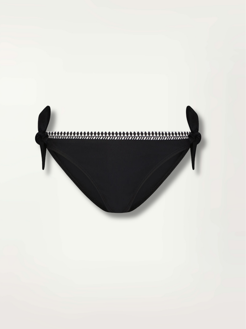 product shot of the sofia side tie bikini bottom in black with graphic white diamond trim