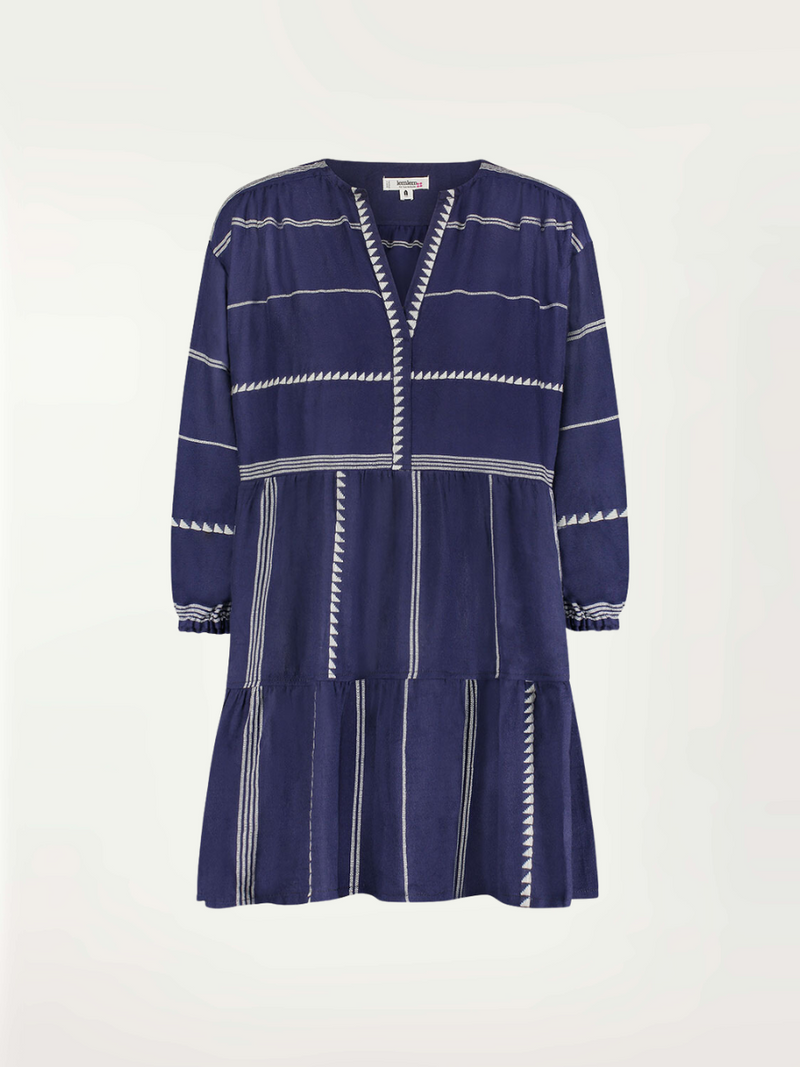Product-shot of a navy Nunu short popover dress with white triangles and stripes