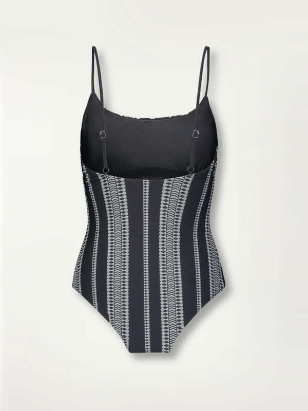 product shot of the back of the Luchia Classic one piece swimsuit in black with white graphic diamond and arrows