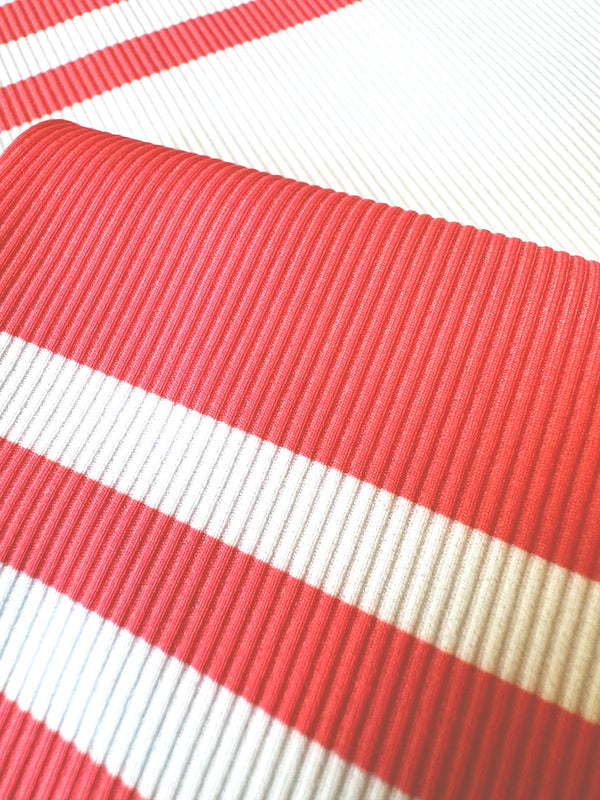 Close up on lemlem Ayele Fragaria Fabric featuring bold two-tone stripe pattern in watermelon pink and soft rosy cream