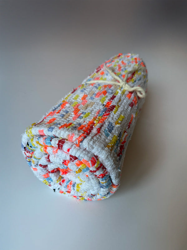Product shot of lemlem upcycled handwoven MESFIN Rug with multicolored patterns
