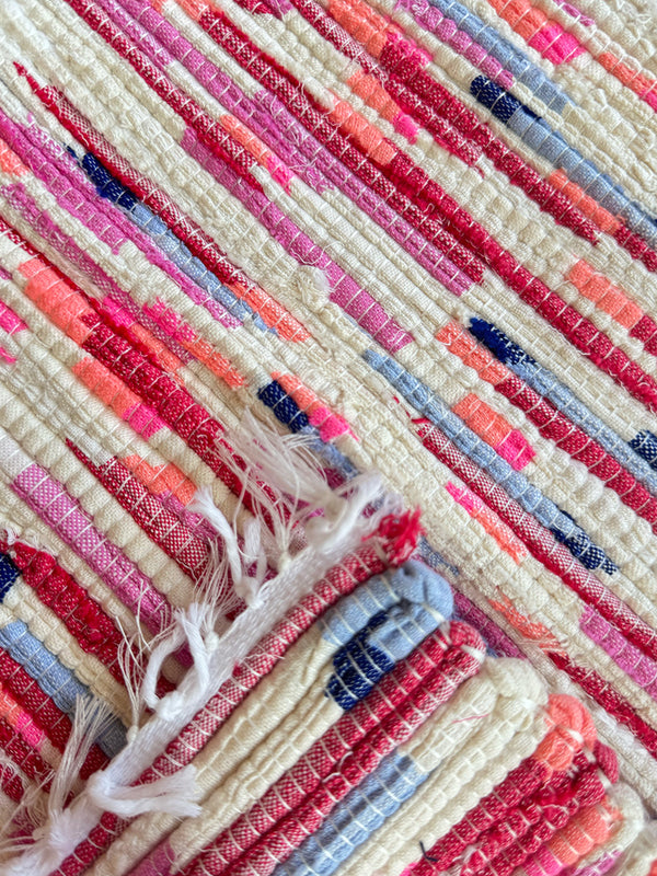 Product shot of lemlem upcycled handwoven MESFIN Rug with multicolored patterns