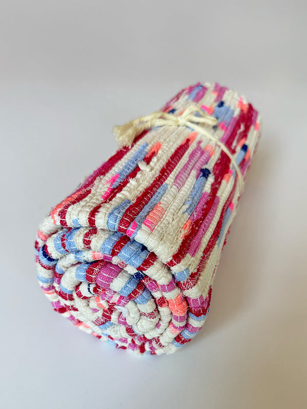 Product shot of lemlem upcycled handwoven MESFIN Rug with multicolored patterns