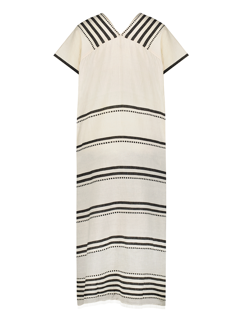 Product shot of the back the Eshe Long Caftan Dress featuring architectural and textured black stripes and dotted lines on an off white background.