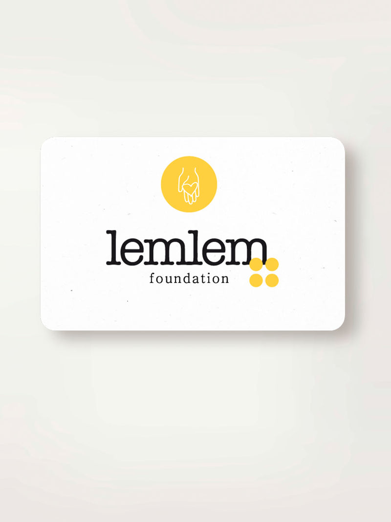 Card with lemlem foundation logo with black text and four yellow dots and a hand drawing with a heart in its palm.
