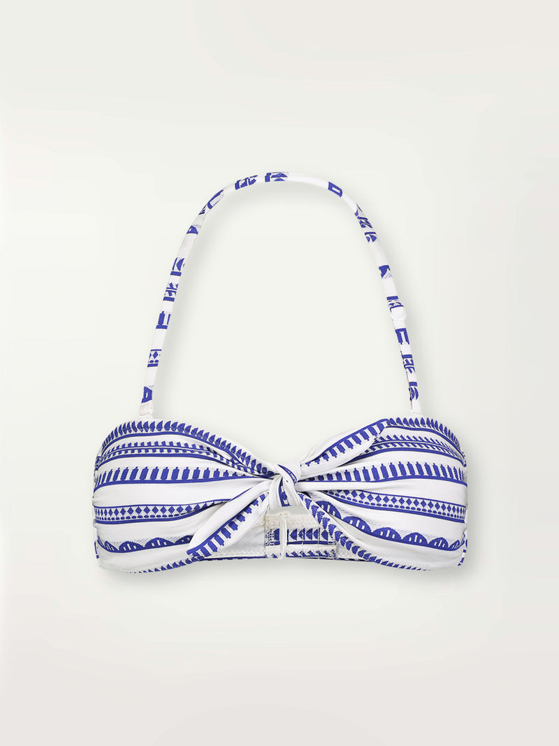 Product shot of the Yani Bandeau Top featuring blue tibeb diamond design bands on a textured seersucker white background.  