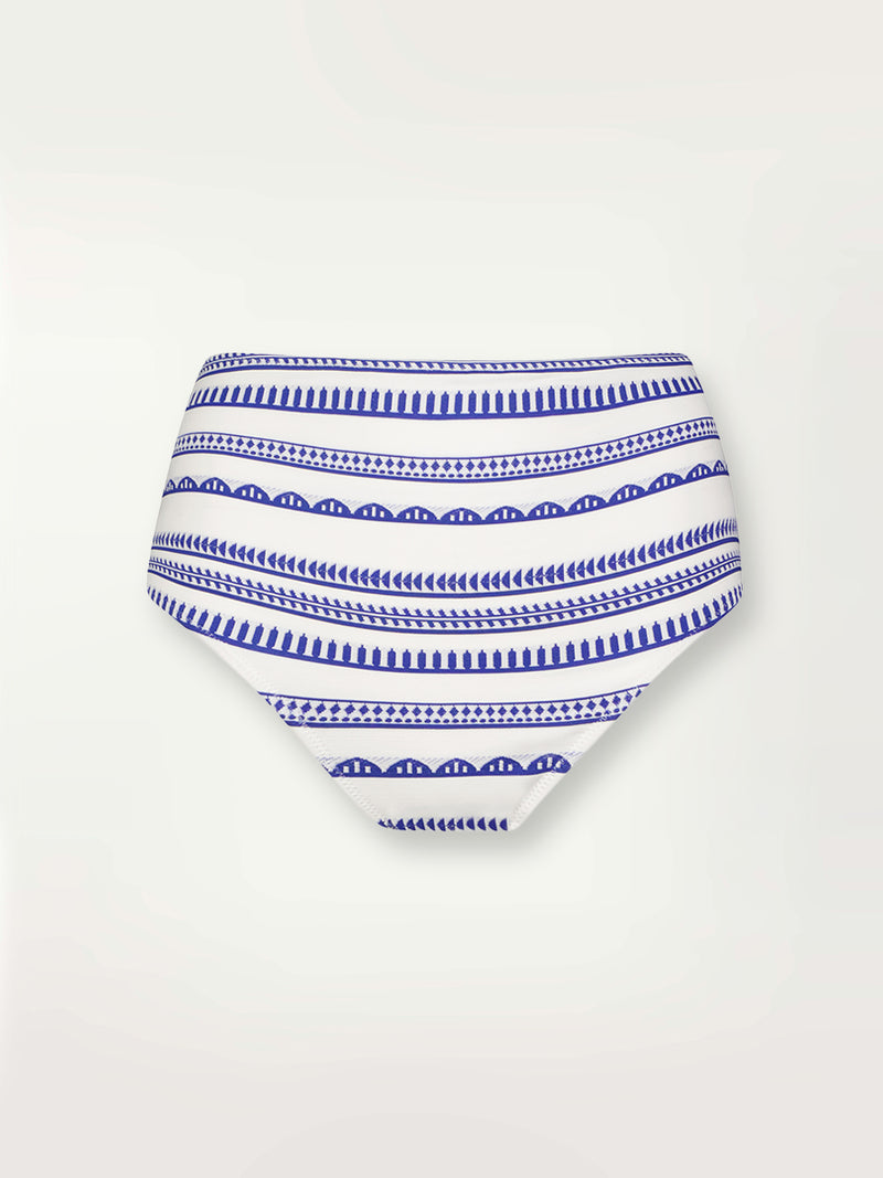 Product shot of the Yani High Waisted Bikini Bottom featuring blue tibeb diamond design bands on a textured seersucker white background.  