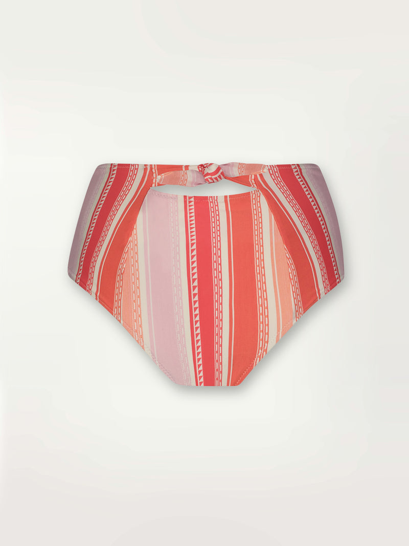Product shot of the back the Eshal High Waist Bikini Bottom featuring white doted stripes with gradiant orange and tangerine bands on a lilac and white background.
