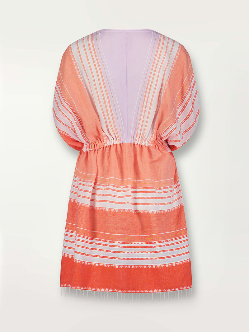 Product shot of the back the Eshal Short Plunge Neck Dress featuring white doted stripes with gradiant orange and tangerine bands on a lilac and white background.