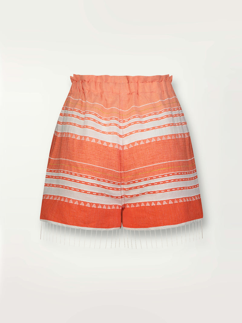 Product shot of the back the Eshal Shorts featuring white doted stripes with gradiant orange and tangerine bands on a lilac and white background.
