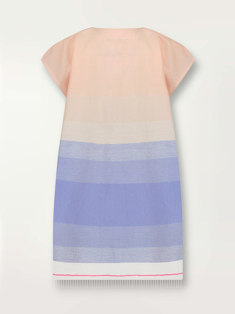 Product shot of the back the Jelba Tunic Dress featuring gradient color block design of nine shades of soft pink and blues highlighted by a bright pink mini stripe at the edge of the dress.