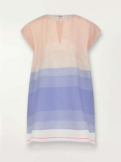 Product shot of the Jelba Tunic Dress featuring gradient color block design of nine shades of soft pink and blues highlighted by a bright pink mini stripe at the edge of the dress.