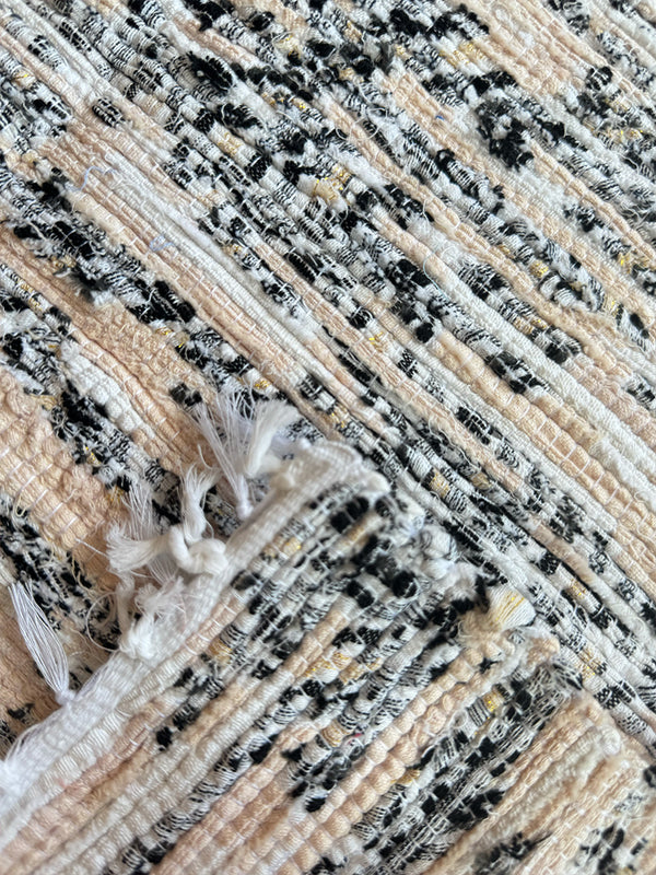 Product shot of lemlem upcycled handwoven MESFIN Rug with multicolored patterns